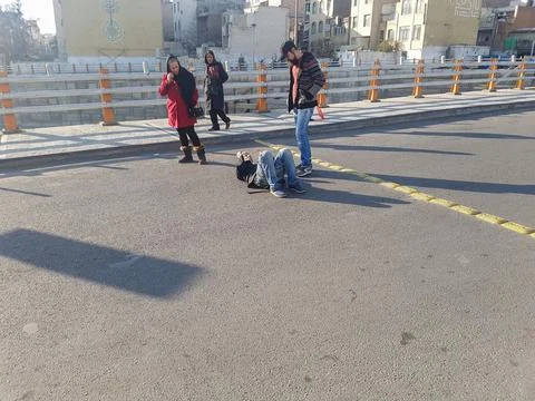A man who threw himself down in the middle of the street Stock Photos
