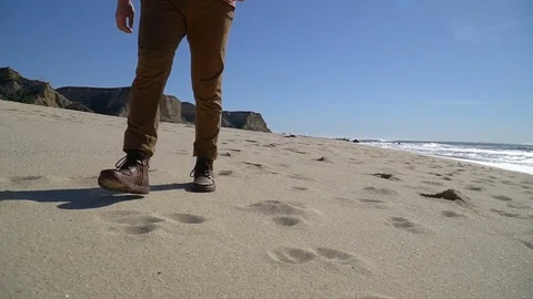 Man who is walking on the beach Stock Footage 82307425