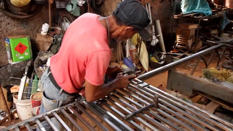 Man Wielding Metal Stock Footage 144222237