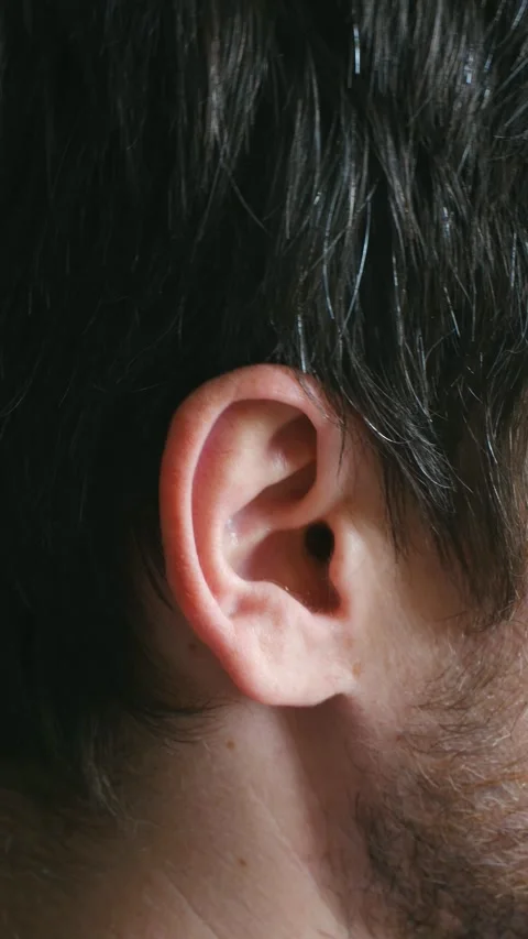 Man wiggling his ear close up detail 스톡 동영상 337892295