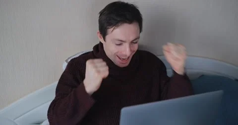 Man win a jackpot looking in laptop Stock Footage 147595513