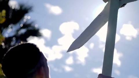 Man with an Wind propeller Craft in a windy day. Wind energy concept. Stock Footage 98270546