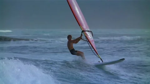 Man wind surfing in ocean Stock Footage 163158777