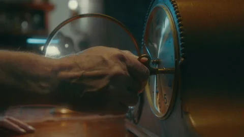 Man Winding Up Clock 스톡 동영상 132718137