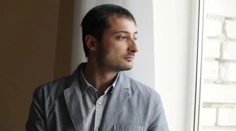 A man by the window Stock Footage 48485990
