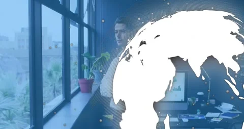 Man by window launching rotating globe covering office then revealing chart for Stock Footage 318193991