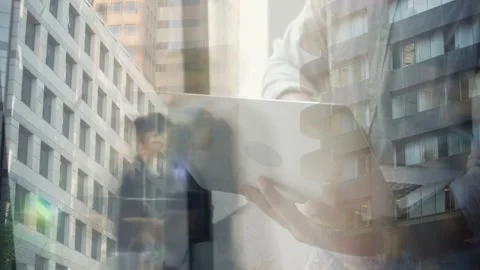 Man at window opening and using laptop causing reflections mixing subject and Stock Footage 333034672