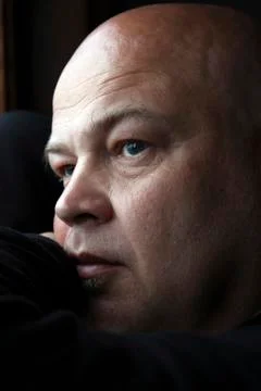 Man at the window Stock Photos