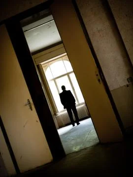 Man in window Stock Photos