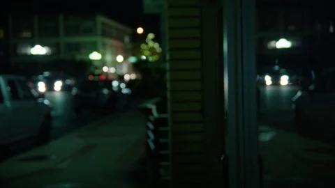 Man Window Shops at Night 動画素材 77207123