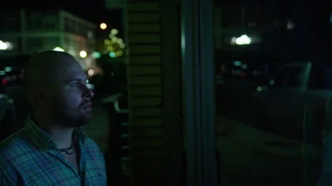 Man Window Shops at Night Stock Footage 77207178