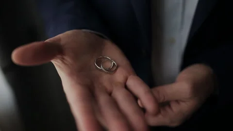 The man at the window shrinks in the palm engagement ring. Stock Footage 111805737