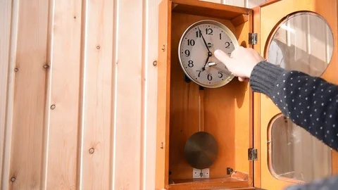 A man winds up a mechanical watch Stock Footage 73403014