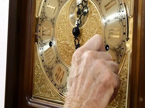 A man winds up a mechanical watch Stock Footage 78028712