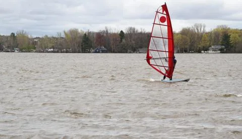 Man windsurfing on a board Stock Photos