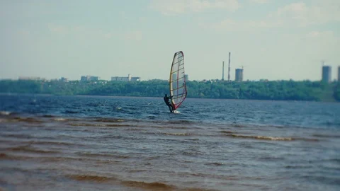 Man windsurser on the river in summer Video stock 108196854