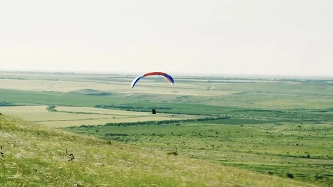 Man with a wing soars in a blue sky Video stock 76760930