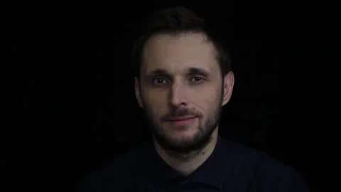 Man winks at camera Stock Footage 144215387