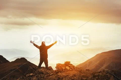 Man winner pose win mountains concept Stock Photos