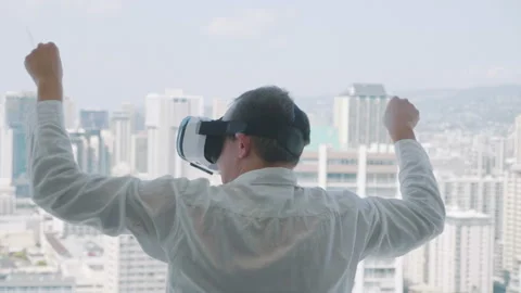 Man winning game in virtual reality glasses in 4k slow motion Stock Footage 87376177