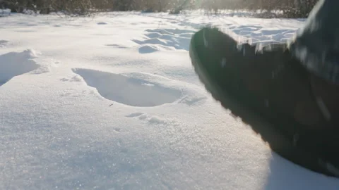 Man in Winter Boots Walking Through Deep Snow Outdoors | Low Angle Close-Up Slow Stock Footage 329315275