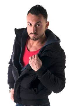 Man with winter coat open on his chest, looking at camera Stock Photos
