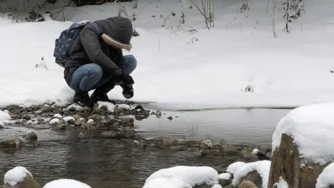 Man at winter creek Stock Footage 72815807