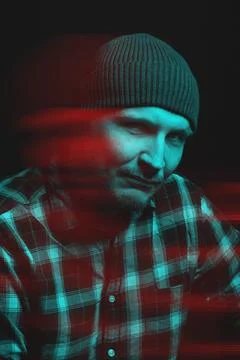Man with winter hat and checkered shirt studio portrait in glitch and RGB c.. Stock Photos