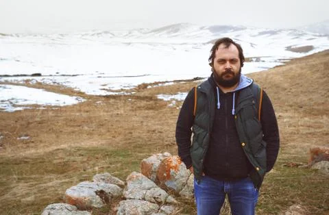 Man in the winter steppe looking at camera Stock Photos