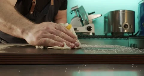 Man Wipes Cutting Board Front Shot 4K 24 fps Stock Footage 149630242