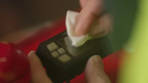 A man wipes a device on a bicycle Stock Footage 265085064