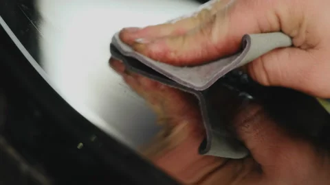 Man wipes surface of vehicle analyzing condition of material Stock Footage 316183779