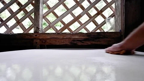 Man wipes a white table with a rag Video stock 122155479