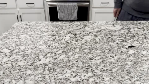 Man Wiping Down White Black Granite Countertops Stock-Footage 318994520