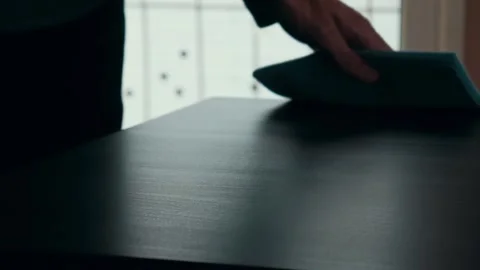 Man wiping the dust from the table with blue cloth. Cleaning 스톡 동영상 105959942
