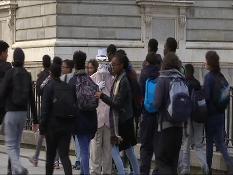 A man without a head walking through the streets of Madrid Stock Footage 78073748