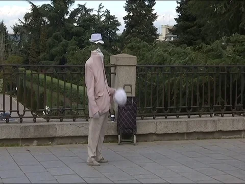 A man without a head walking through the streets of Madrid 1 Stock Footage 78073908