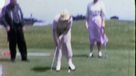 Man Woman Putts Ball Golfers Golf Club Golfing 50s Vintage Film Home Movie 1839 Stock Footage
