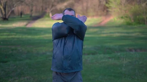 The Man in the Woods Performs Concentrated Breathing Exercises of Chi Stock Footage 74695453