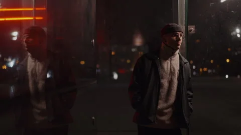 Man with wool hat outdoors waiting for someone Stock-Footage 258529900
