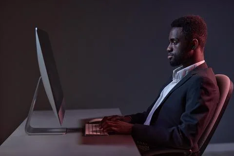 Man work african freelancer technology lifestyle american keyboard online night Stock Photos