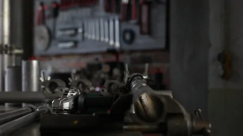 Man work with angle grinder, goggles and construction gloves, grinder metal i Stock Footage 118609323