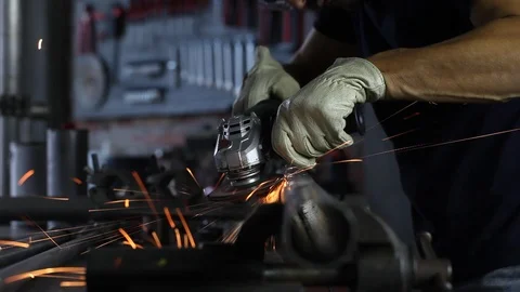 Man work with angle grinder, goggles and construction gloves, grinder metal i Stock Footage 118610168