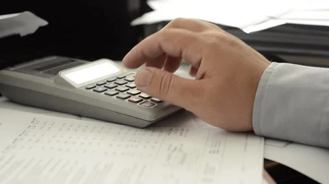 Man work on calculator Stock Footage 52012328