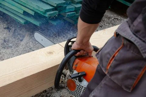 Man at work with chainsaw Stock Photos