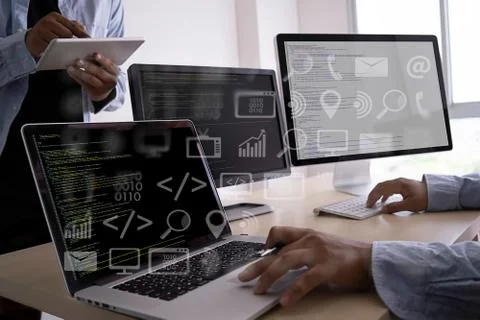 Man work Coding software developer programmer is coding on a desktop computer Stock Photos