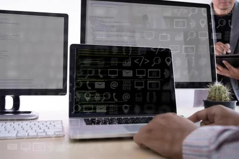 Man work Coding software developer programmer is coding on a desktop computer Stock Photos