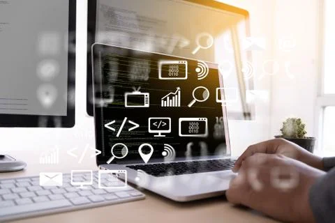 Man work Coding software developer programmer is coding on a desktop computer Foto stock