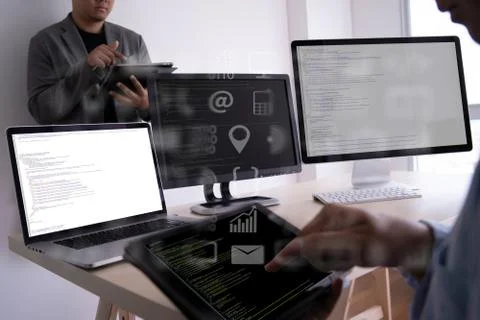 Man work Coding software developer programmer is coding on a desktop computer Stock Photos