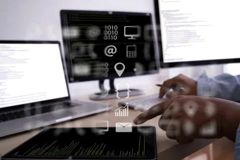 Man work Coding software developer programmer is coding on a desktop computer 库存照片